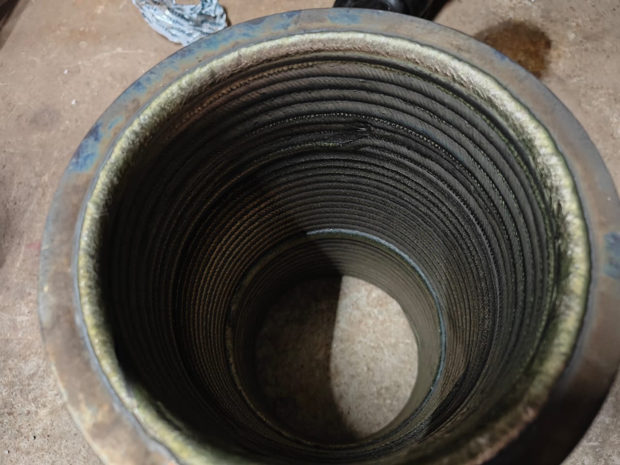 Top-down view of internal weld cladding beads in a bore