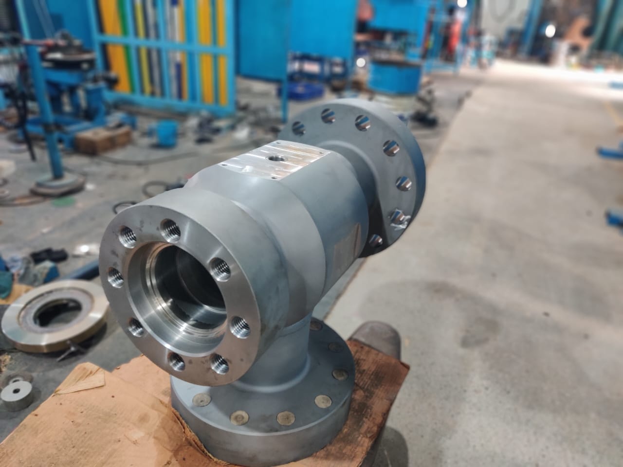 Large flanged tee valve body on the shop floor