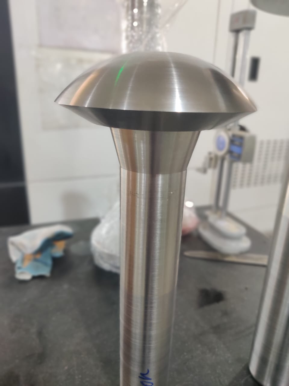 Machined globe valve disc with domed sealing face